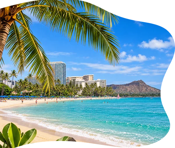 Palm trees and blue ocean along Waikiki Beach