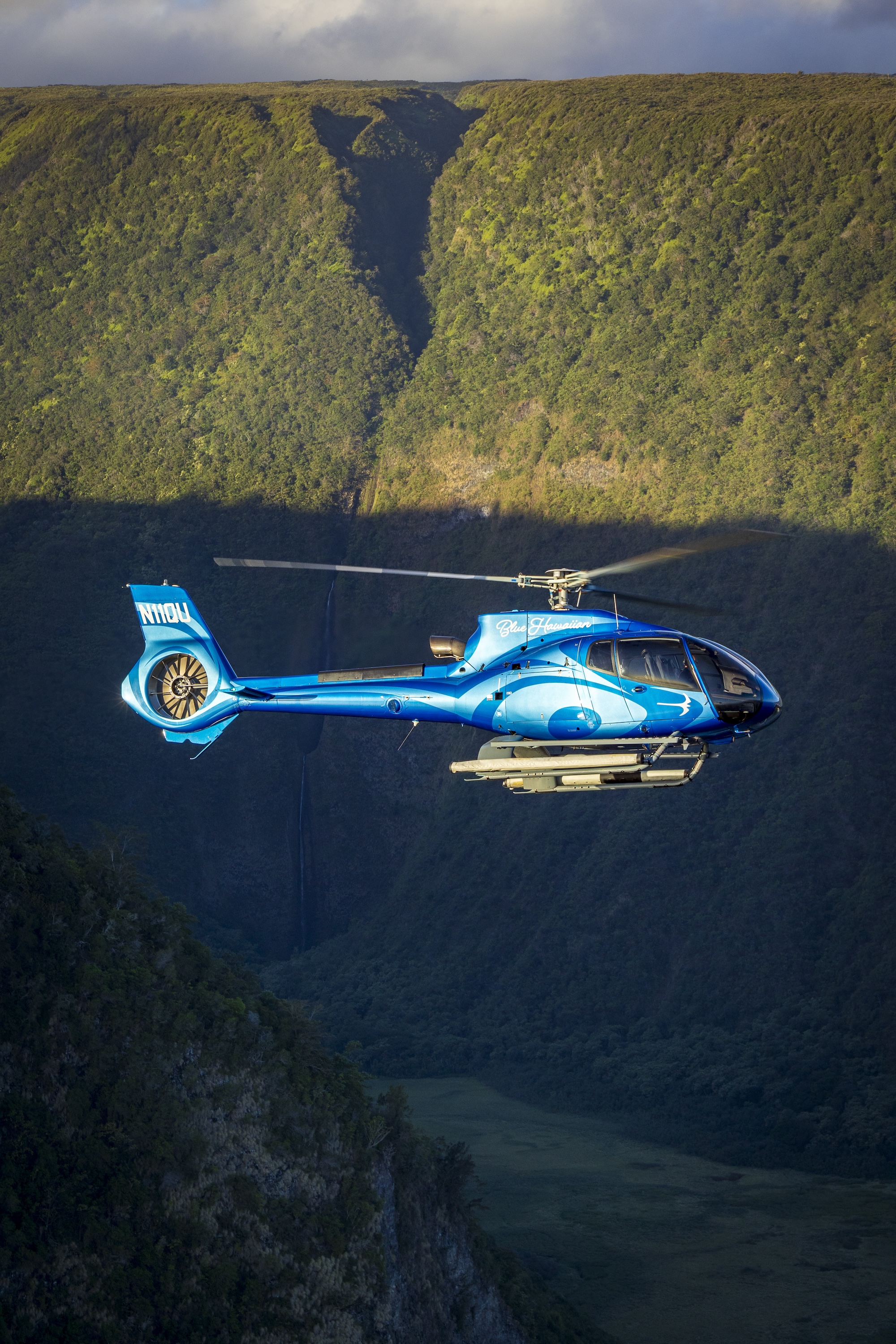 Lush Hilo valley from above – green rainforest ridges and streams on the Big Island