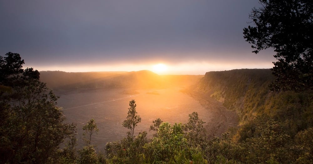 Sunset skies over volcanic terrain on the Big Island during an evening tour