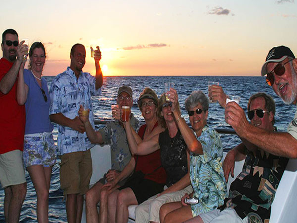 Pau Hana sunset cruise with whales featuring golden-hour ocean views and opportunities to spot humpback whales off the Big Island