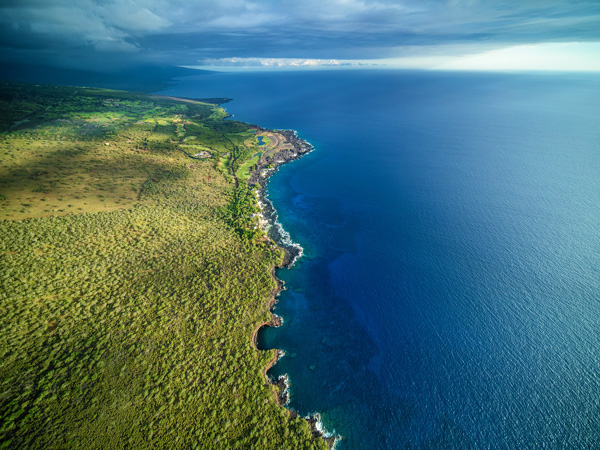 Scenic aerial views over the Big Island’s Kona coastline and rugged lava shoreline