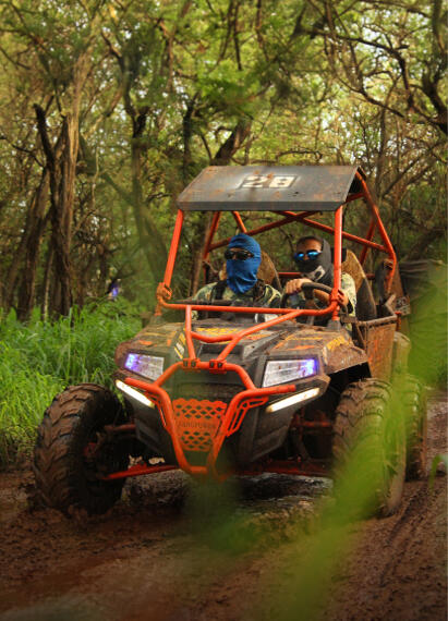 Side-by-side ATV ride at Coral Crater on Oahu with two riders tackling a dusty off-road course