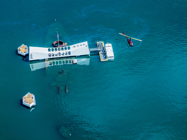 Aerial view of Pearl Harbor during the Isle Sights Unseen helicopter tour highlighting historic naval sites